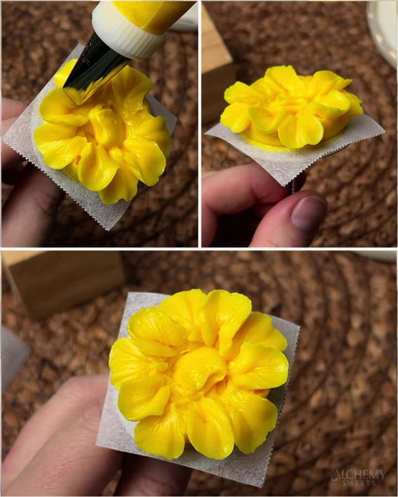 A partially formed yellow buttercream marigold with a second, slightly lifted layer of petals added between the first-layer petals.